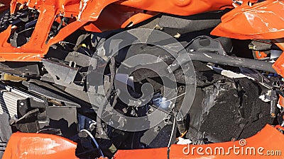 Orange car crash background. Close-up detail of auto wreck. Front side of crashed car from accident. Car accident. Stock Photo