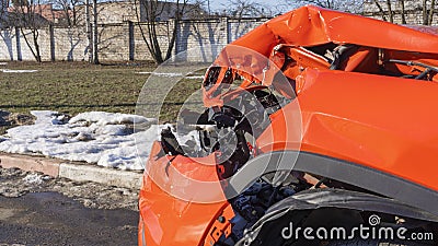 Orange car crash background. Close-up detail of auto wreck. Front side of crashed car from accident. Car accident. Stock Photo