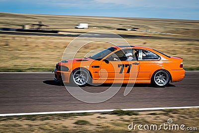 Orange car on race track Editorial Stock Photo