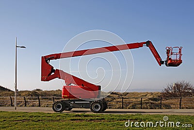 Orange cherry picker Stock Photo