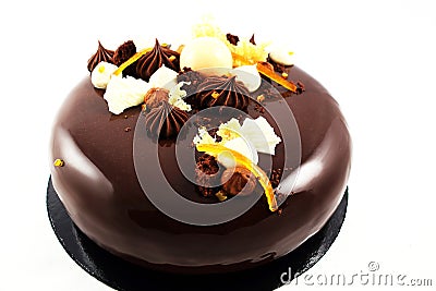 Orange chocolate cake with chocolate ganache and whipped white chocolate cream Stock Photo