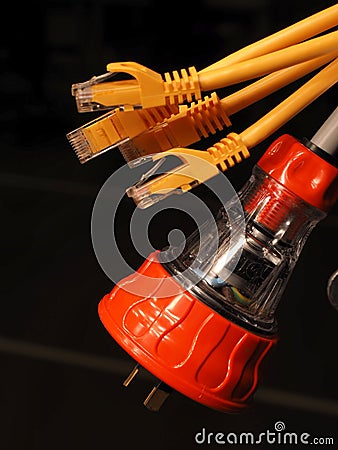 Orange and clear industrial 240V power and several yellow data plugs Stock Photo