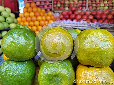 Green oranges display on the fruits market,orange close up view Stock Photo