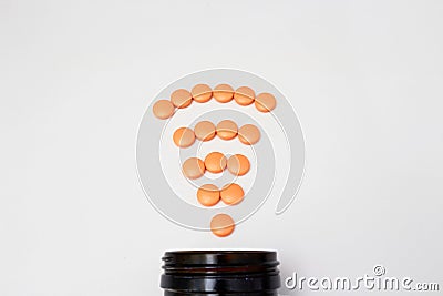 Orange coated round drug tablets on drugstore and bottle in communicated worldwide distribution wifi connected business medical Editorial Stock Photo