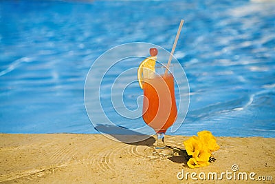 Orange cocktail and a yellow flower Stock Photo