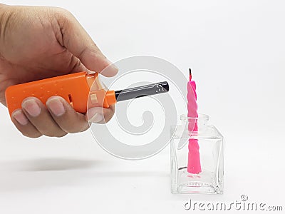 Orange Color Automatic Lighter for Kitchen Utensils and Birthday Candles in White Background 15 Stock Photo