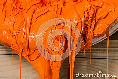 orange color of plastisol ink flowed out of the barrel Stock Photo