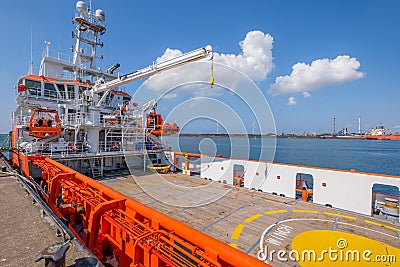 Orange colored EU ship for fishery inspection in the port of IJmuiden, the Netherlands. Editorial Stock Photo