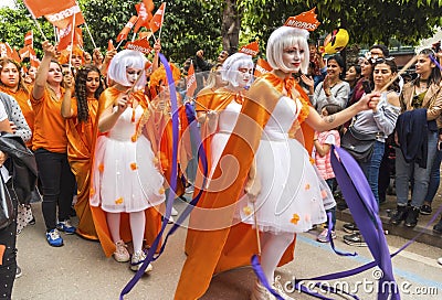 Orange colours fairy girls dancing in Orange Blossom Carnival parade`s opening. City of Adana Province in Turkey - 6 April 2019 Editorial Stock Photo