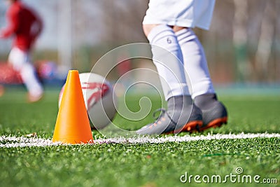 Orange cone for training football and child soccer Stock Photo