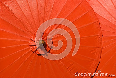 Orange cotton umbrellas in Thailand Stock Photo