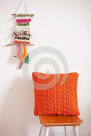 Orange crocheted pillow Stock Photo