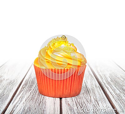 Orange cupcake with yellow cream Stock Photo