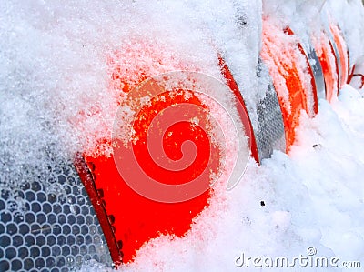 Orange cylinder construction under snow Stock Photo