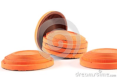 Orange cymbals for trap shooting on white background Stock Photo
