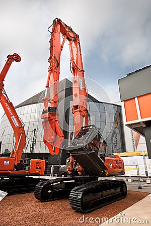 Orange diesel excavator Editorial Stock Photo