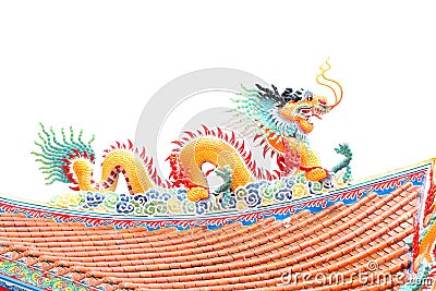 Orange Dragon sculpture on the roof. Stock Photo