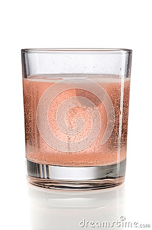 Orange effervescent tablet in a glass of water. Stock Photo