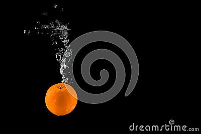 Orange falling in to water Stock Photo