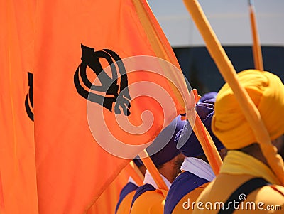 Orange flag with symbol of the Sikh religion called KHANDA forme Stock Photo