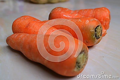 Orange and fresh carrots ready for cooking or juicing Stock Photo