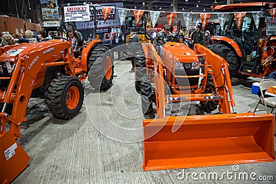 Orange Front End Loaders on Display Editorial Stock Photo