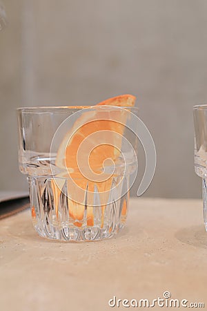 Orange fruits slice in glass. Freshly Cut Natural Healthy Juicy Organic Stock Photo