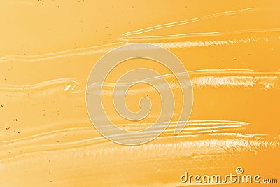 Orange gel texture. Cosmetic clear liquid cream smudge. Transparent skin care product sample closeup Stock Photo