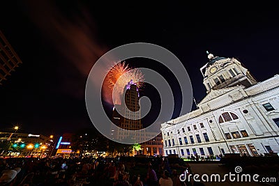 Orange and gold 4th of July fireworks downtown Fort Wayne courthouse and Lincoln Tower Editorial Stock Photo