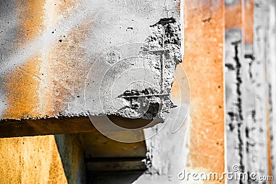 Orange and gray damaged reinforced concrete structure Stock Photo