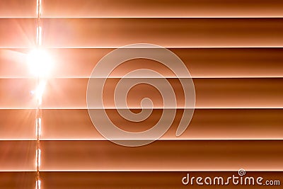 Orange horizontal blinds on the window create a rhythm through t Stock Photo