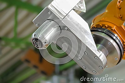 Orange industrial welding robotic arm manipulator at exhibition - close up Stock Photo