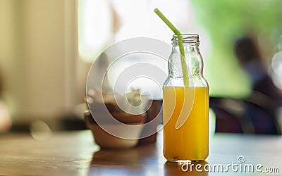Orange Juice bottle with straw Stock Photo