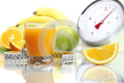 Orange juice in glass, fruit meter scales diet food Stock Photo
