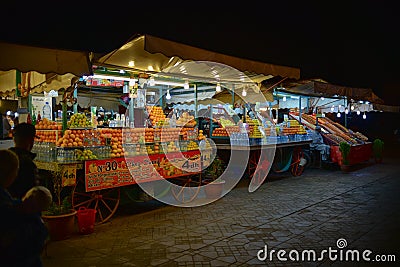 Marrakesh orange juice stall in Djamaa El Fna square in Marrakesh, Morocco, Africa night scene Editorial Stock Photo