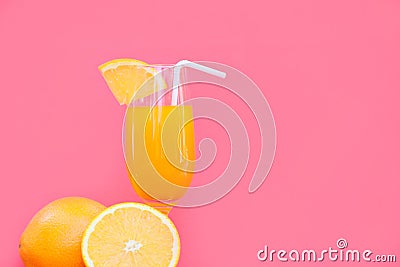 Orange juice summer glass piece orange fruit with red pink background Stock Photo