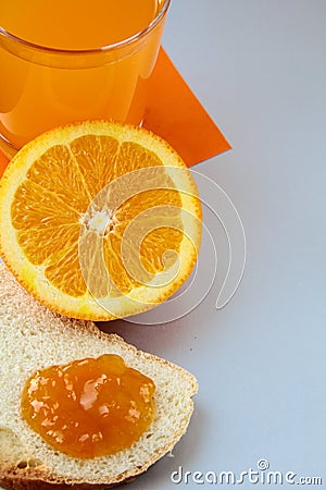 Orange, juice and toast with orange marmalade Stock Photo