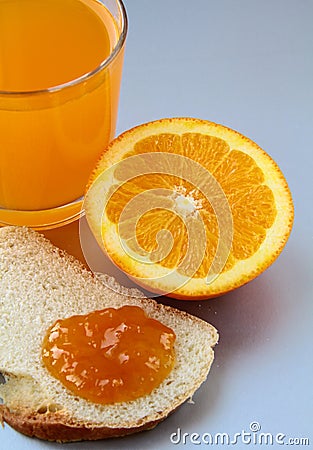 Orange, juice and toast with orange marmalade Stock Photo