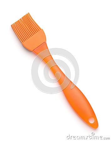 Orange kitchen silicone basting brush Stock Photo