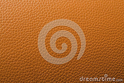 An orange leather background pattern Stock Photo