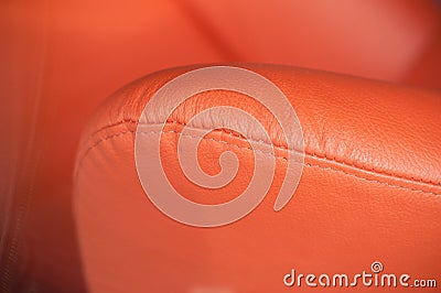 Orange leather sofa armrest Stock Photo