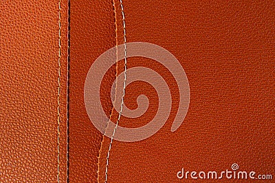 Orange leather with white stitch closeup for background. Stock Photo