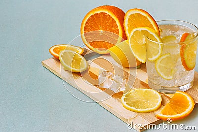 Orange, lemon, glass homemade lemonade and ice Stock Photo