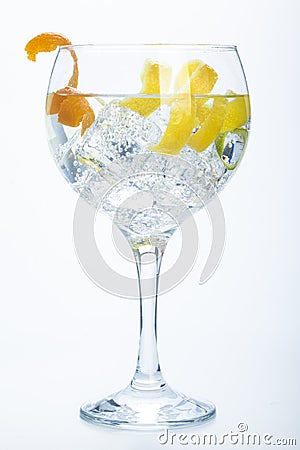 Orange lemon and lime gin tonic isolated over white Stock Photo