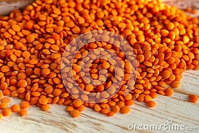 Orange lentils on a white wooden background. Stock Photo