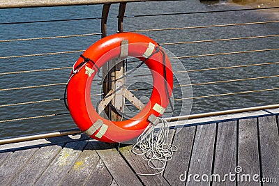 Orange Life Saver on Dock Stock Photo