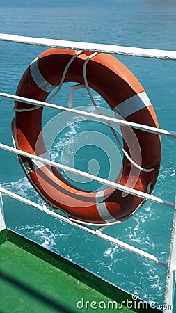 Orange Lifebelt on Cruise Ship Railings Stock Photo