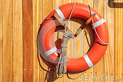 Orange lifebuoy on old sailing ship Stock Photo