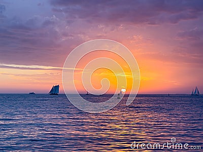 Stormy Sunset Sailboats Stock Photo