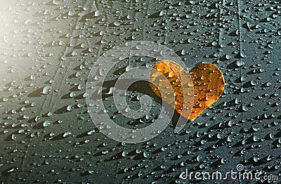 Orange lover heart on the raindrops background, Health Care Stock Photo